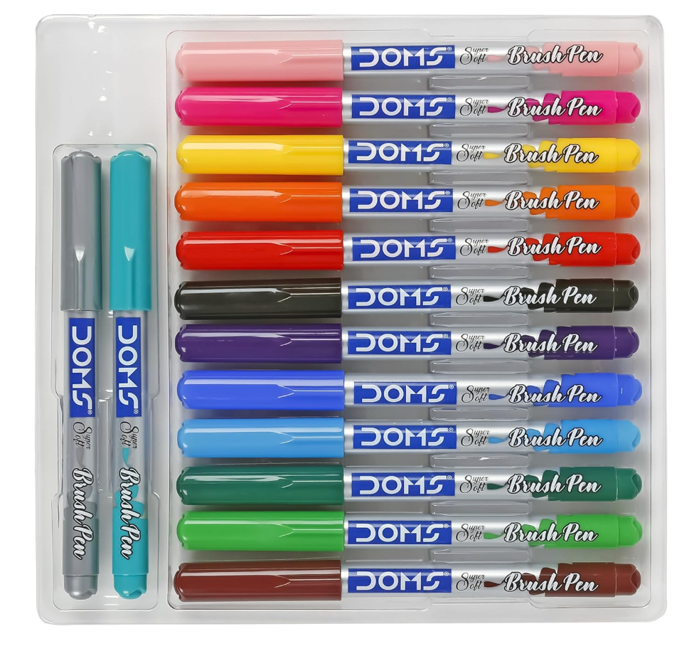 DOMS Brush Pens – 13 assorted shades + 1 blender pen laid out in tray