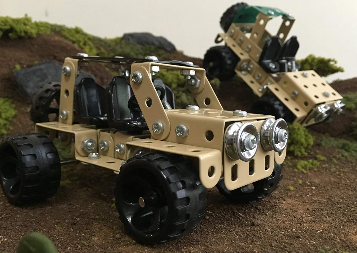 Zephyr Mechanix Safari two models in outdoor terrain setting