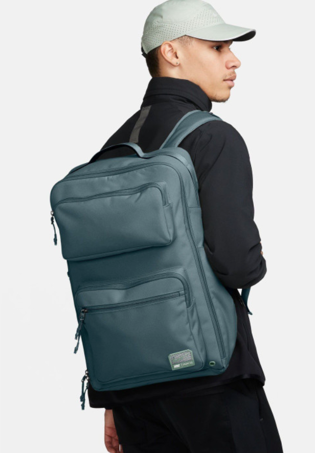 Nike Utility 2.0 Backpack slate teal lifestyle shot held by hand