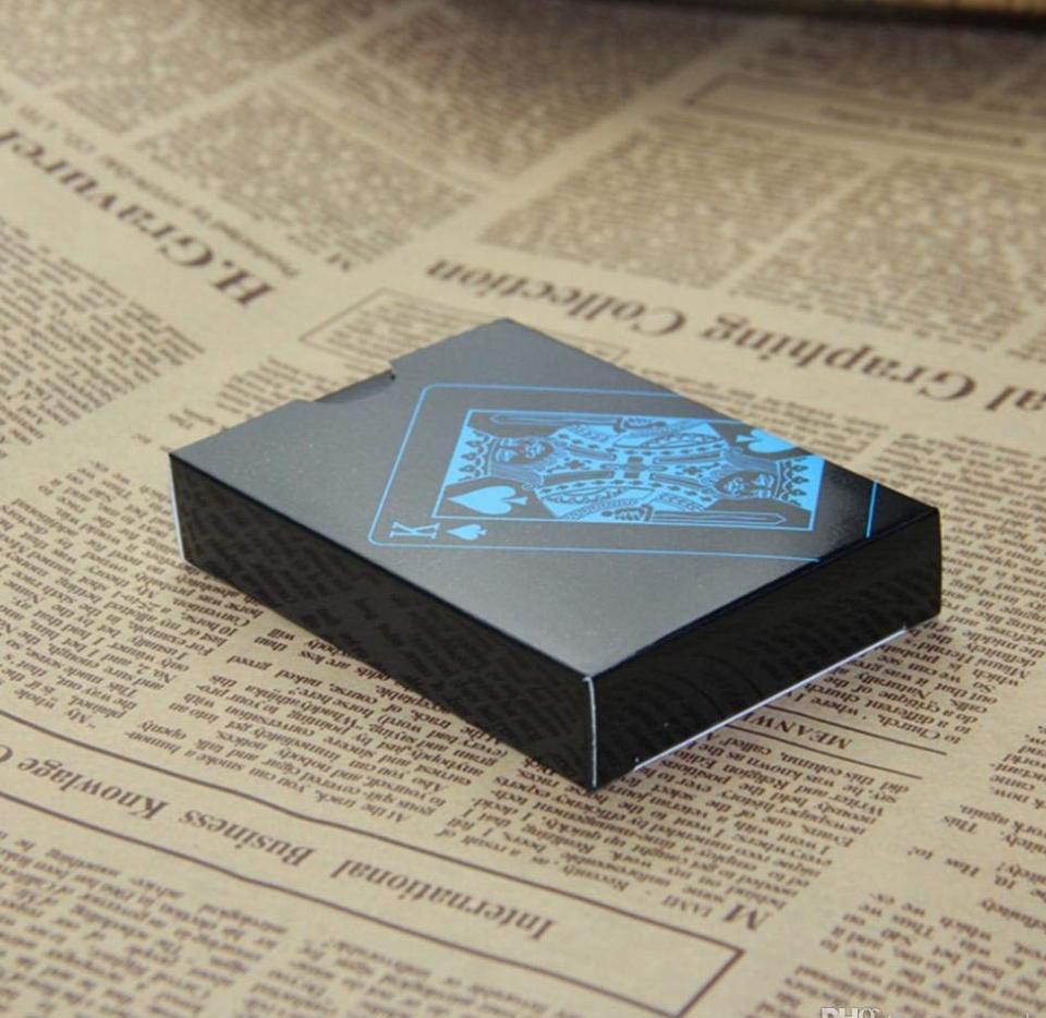 Black aces with blue and white suits and matching playing-card box