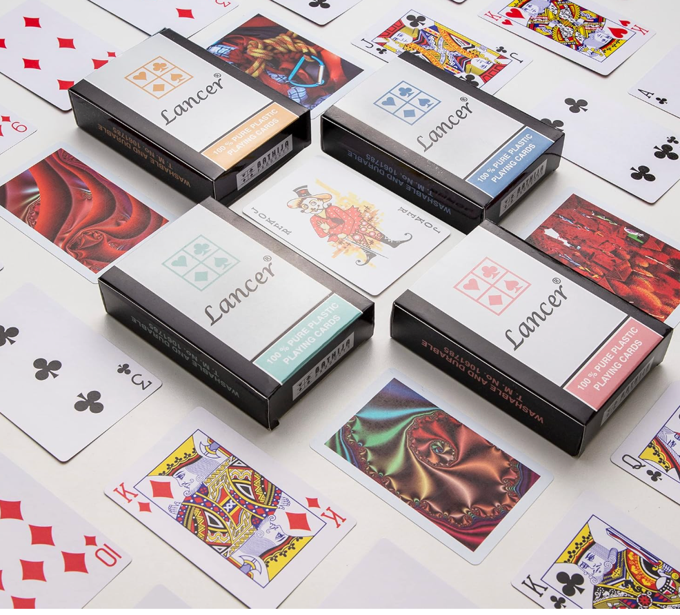 Four Lancer card boxes surrounded by playing cards
