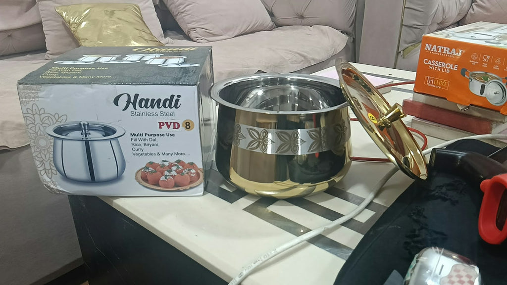 Original photograph of PVD 8 floral handi with gold exterior, silver interior, matching lid and box