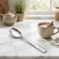 Cielo spoon on marble counter with chai cup lifestyle shot