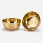 AI-generated studio illustration of a matching gold-tone bowl set of two.