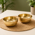 AI-styled gold-tone bowl set of two on a placemat; props excluded.