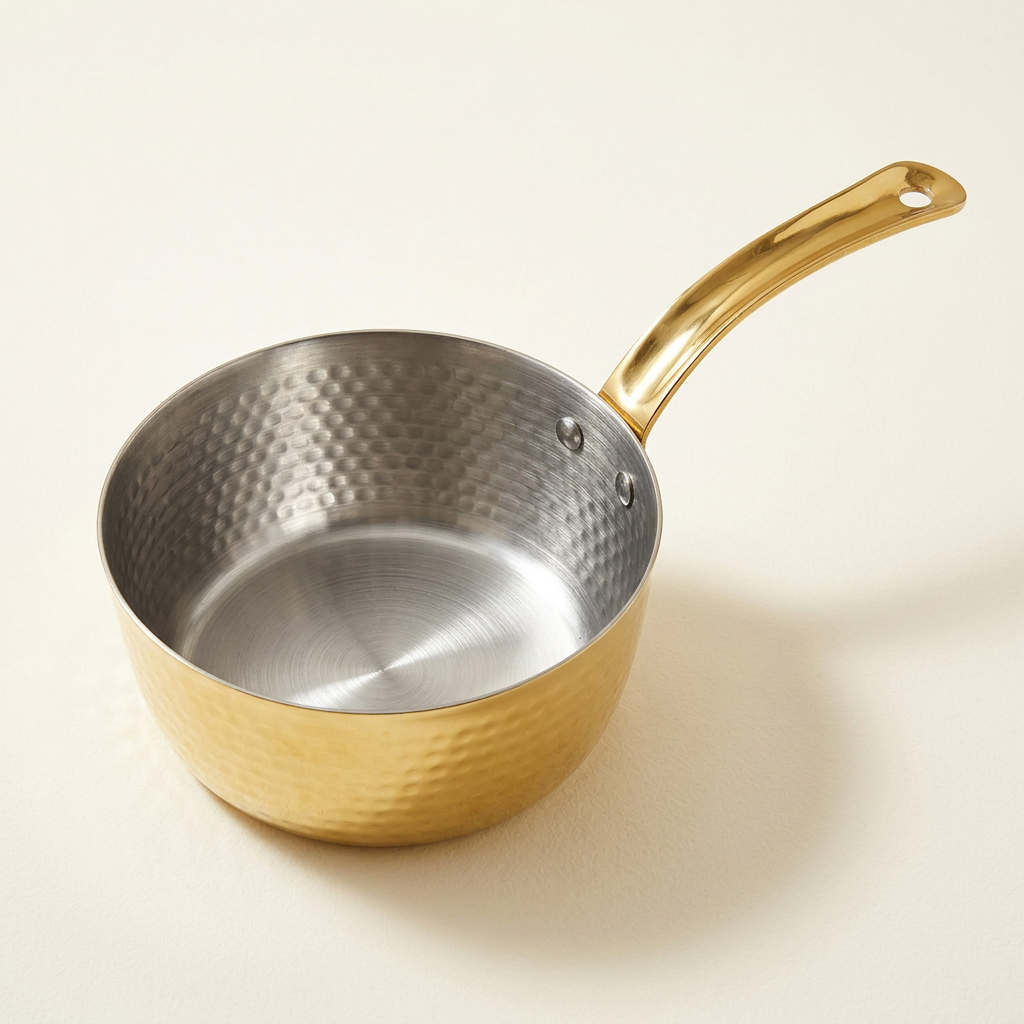 AI-generated studio illustration of Anupam gold-coloured round pan with silver interior