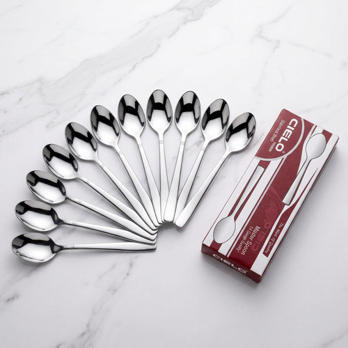 12 Cielo plain spoons fanned out with gift box on marble
