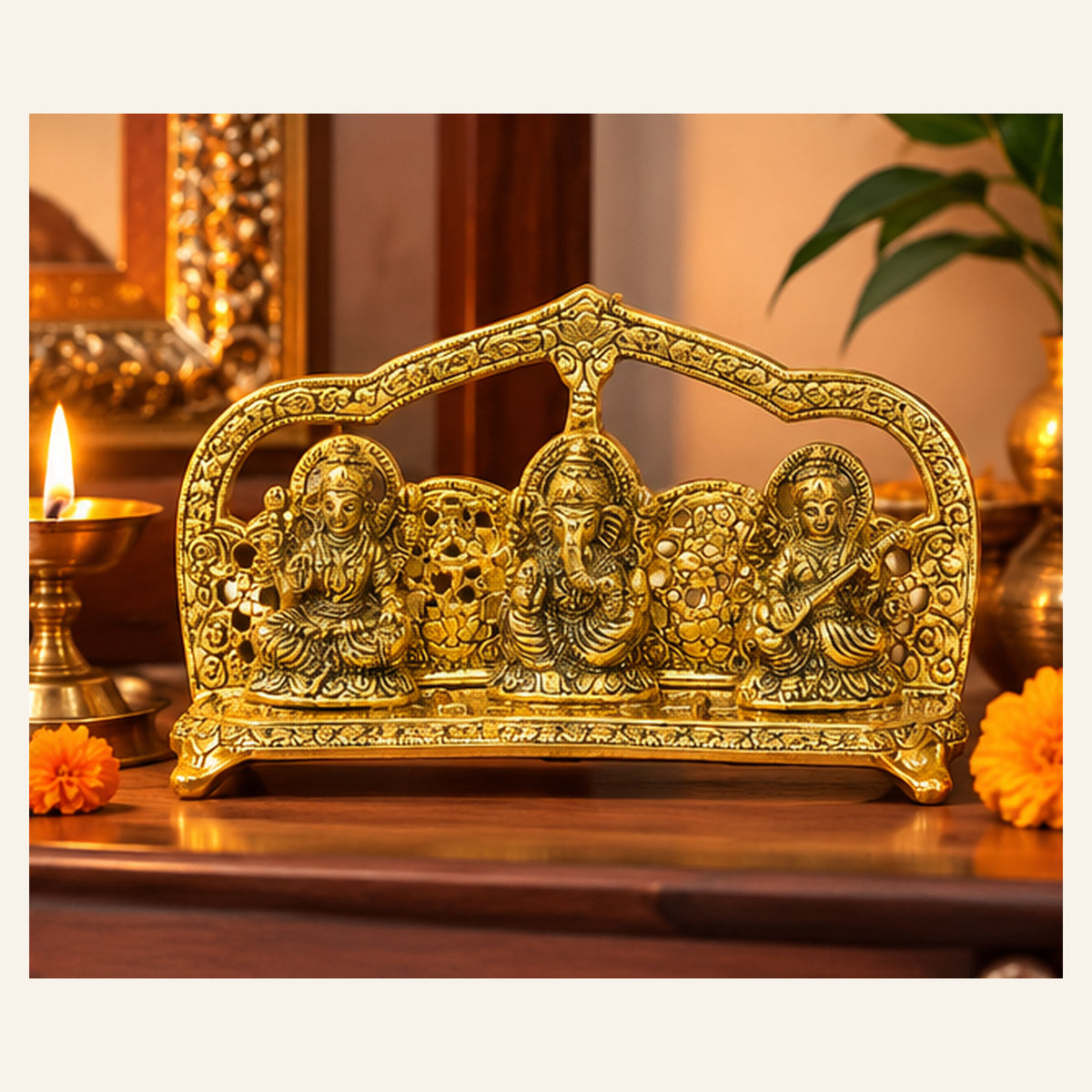 Three-deity decorative stand on a home mandir shelf